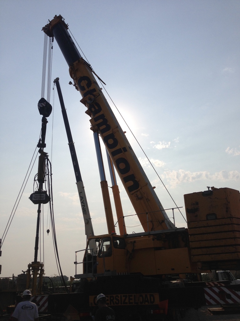 Champion crane supporting specialized vibration equipment on a heavy lift
